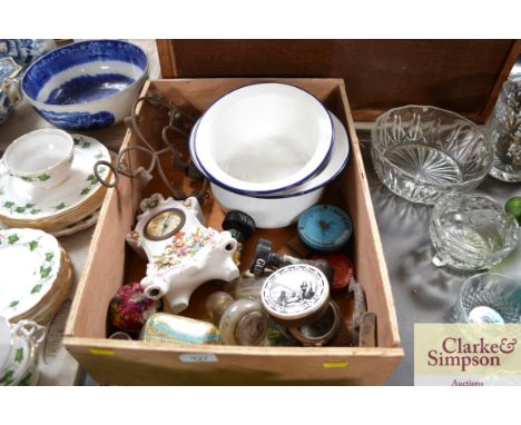 A wooden box containing various tins, mantel clock, Guinness figures etc.