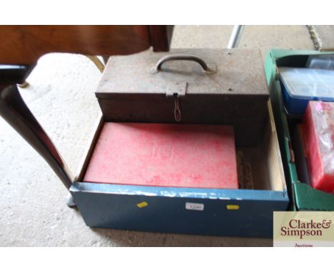 A wooden tray containing a metal tool box and part contents; and two part socket sets