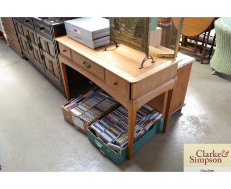 A light oak desk fitted three drawers