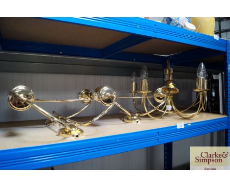 A brass ceiling light together with three brass wall lights