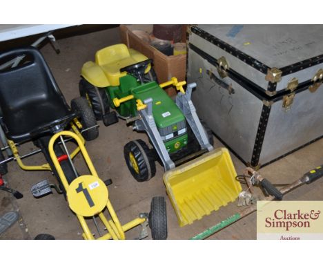 A children's toy pedal John Deere tractor