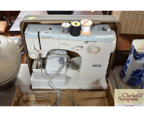 An Elna sewing machine in fitted case (sold as collectors item)