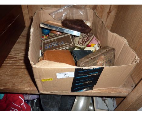 A box containing glass marbles, coins, a compact and various sundries 