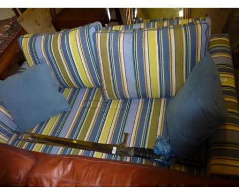 A striped upholstered sofa bed 