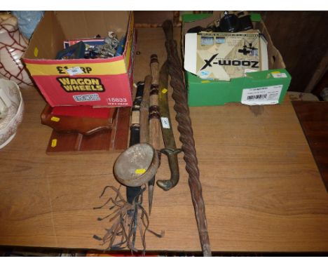 A carved wooden ethnic walking cane; together with a wooden ladle; a short sword etc. 