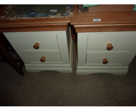 A pair of light oak and painted bedside chests 