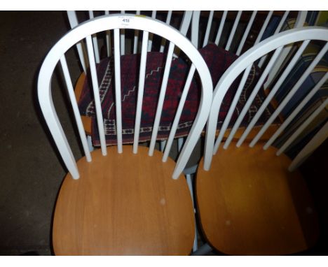 A set of four painted stick back kitchen chairs 