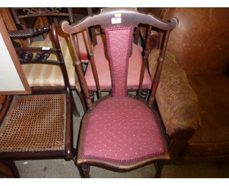 A mahogany stick back chair 