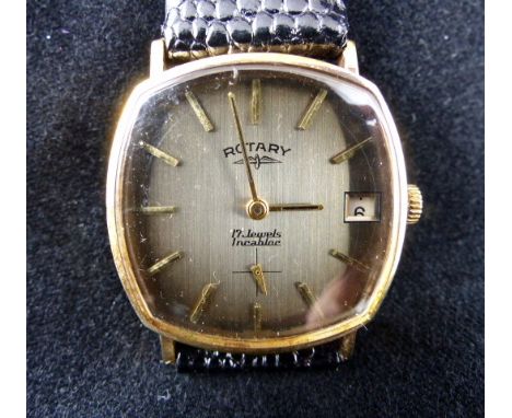 Rotary 9 ct gold wristwatch on leather strap. Working at lotting up.