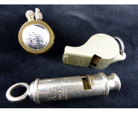 LMS Acme Thunderer railway whistle, a WWII ARP whistle and an unusual trench art lighter