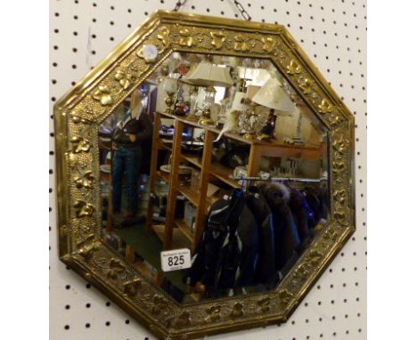 A vintage octagonal brass framed bevelled edged mirror Diameter ~ 34cm