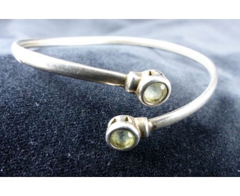Sterling silver peridot set bangle.