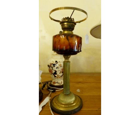 Brass based oil lamp, lacking shade and chimney