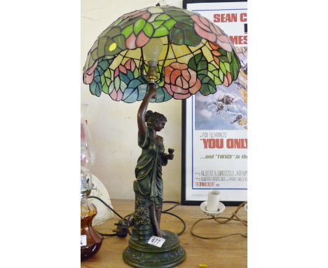 Tall cast resin figural table lamp with Tiffany style glass shade. H: 70 cm