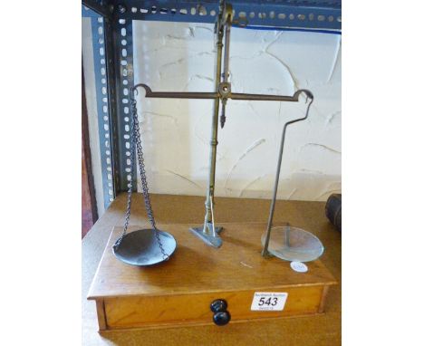 A good set of brass jeweller's scales with wooden drawer base and weights