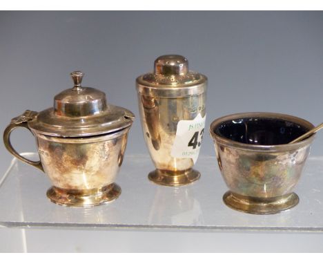 A HALLMARKED SILVER ART DECO STYLE THREE PIECE CONDIMENT SET.