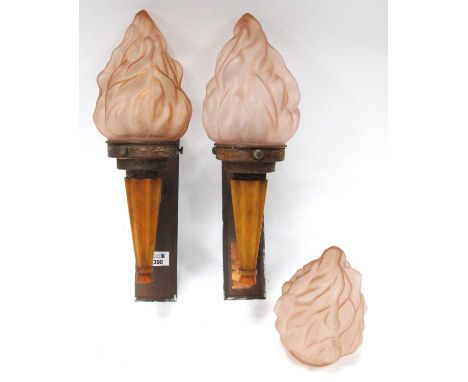 A Pair of Art Deco Wall Lights, with flame effect glass shades, mounted in Butterscotch Bakelite, with copper back plates, an