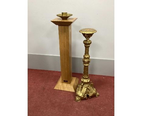 A XIX Century Gilt Candlestick, with foliate decoration, 70cm high; together with a later oak floor standing candlestick bear