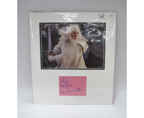 Lord of the Rings - Ian McKellen Autograph, blue pen signed on pink card, as a montage, overall 42.5 x 38cm.