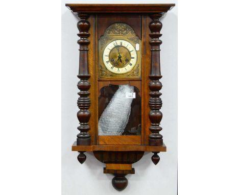 Late XIX Century Walnut Viennese Wall Clock, with eight-day movement, cream, chapter ring, 41cm wide overall.