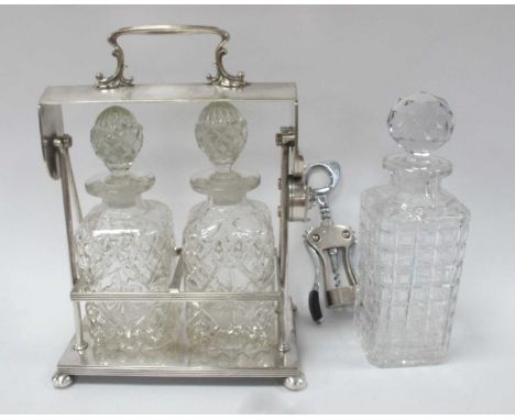 An Early 1900s Twin Bottle Tantalus, silver plated frame with maker's mark to base, plus a large Victorian cut glass decanter
