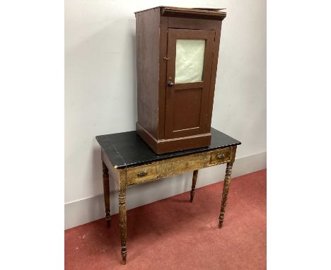 A Pine Cupboard, with a glazed and panelled door; together with a pine side table. (2)