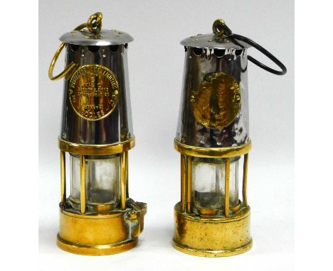 Miners Lamps, protector lamp and lighting of Eccles, both brass lower bodies, 24cm tall with handle down (2).
