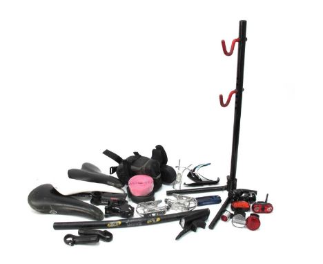 Cycling related parts and spares including 3 leather saddles, alloy stems, handlebars &amp; bar-ends, alloy pedals, bottle ca