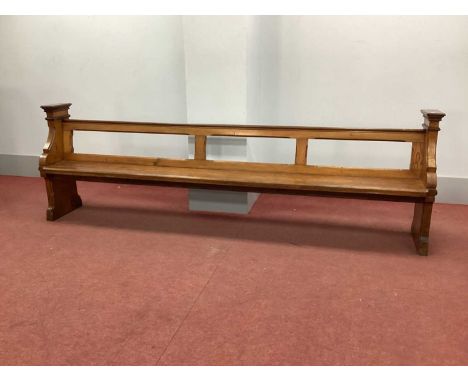 A XIX Century Pitch Pine Pew, with open back and shaped end supports, 295cm wide.