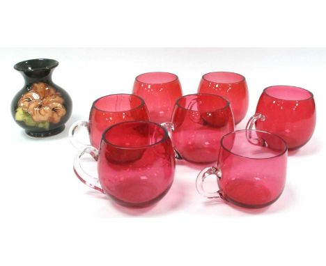 Moorcroft Hibiscus Pottery Vase of Bulbous Form on Green Ground 9cm tall, seven cranberry glass custard cups.