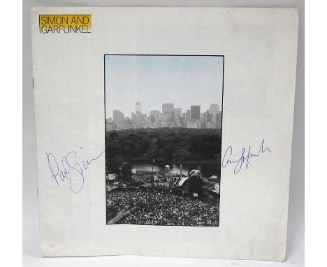Simon and Garfunkel - autographs of Paul and Art, blue ink signed (unverified) on the cover of the booklet.