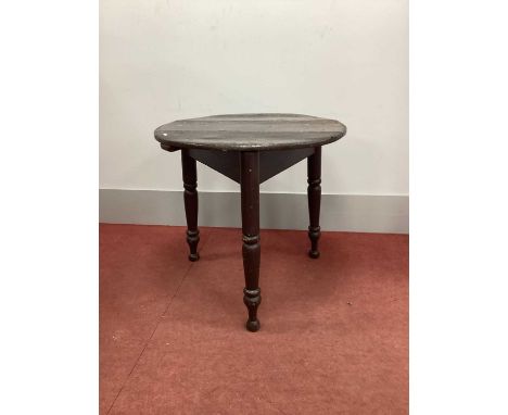A XIX Century Painted Pine Cricket Table, with circular top on three turned supports, 75cm wide.QUITE STURDY, JUST GENERAL WE