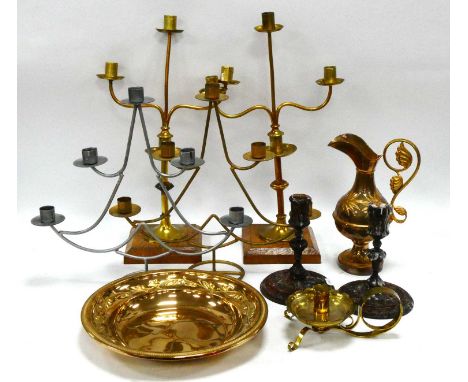 A Gilt Metal Ewer and Dish, each embossed with bullrushes and foliage, a footed brass candlestick, a pair of three branch can