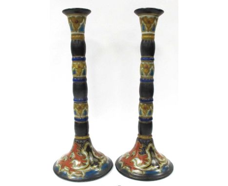 Gouda Pair of Art Deco Purdah Candlesticks, in traditional colours, bobbin stems, 28.5cm high (2)Crack to base on one, some c