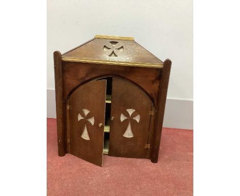 A Gothic Style Oak Cabinet, the pediment with pierced decoration, arched doors similarly decorated, two internal shelves, 57c