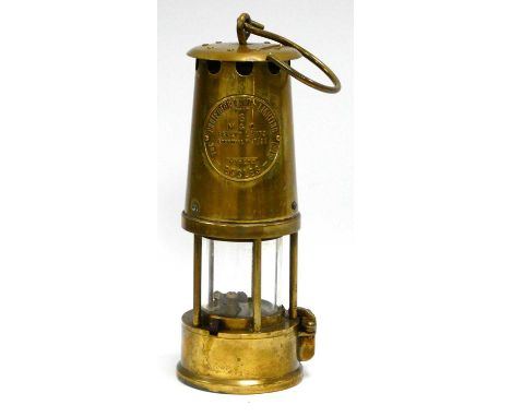 Miners Lamp, protector lamp and lighting of Eccles in brass 24cm tall with handle down.