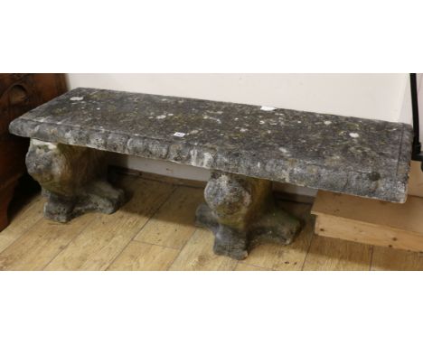 A stone garden bench W.127cm