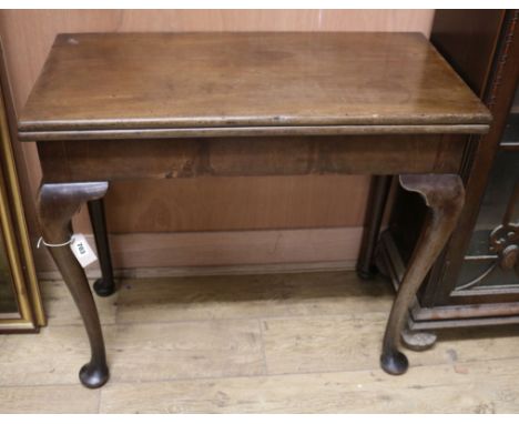 A Georgian mahogany folding rectangular card table W.84cm