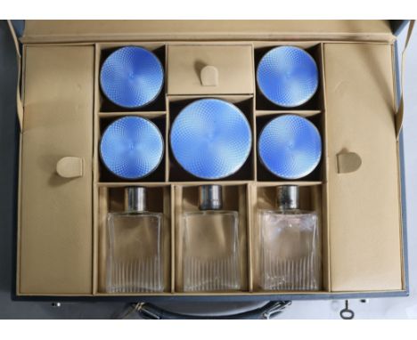 A cased George VI silver and guilloche enamel mounted glass eight piece toilet set, TP, London, 1948/9.