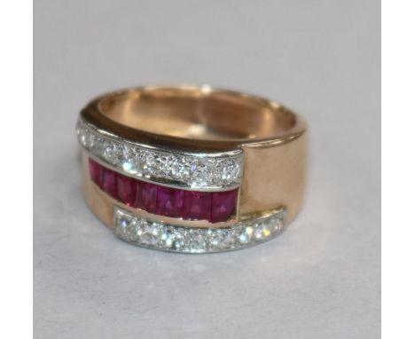 A 1950's yellow metal, ruby and diamond set cocktail ring, size Q.
