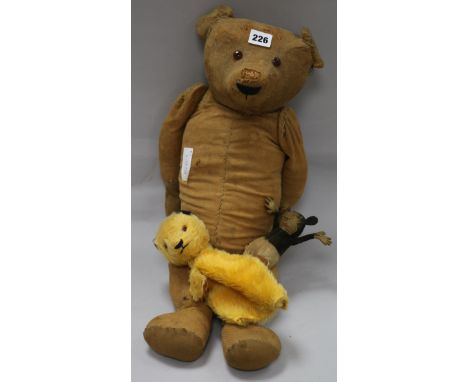 A Deans Ragbook Mickey Mouse, a Chad Valley Sooty hand puppet and an early 20th century teddy bear