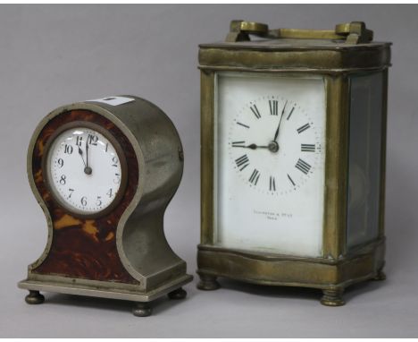 A brass carriage clock and a faux tortoiseshell timepiece