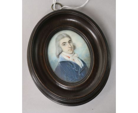 19th century English School, Miniature portrait of a young gentleman wearing a blue coat, watercolour on ivory, oval, moulded