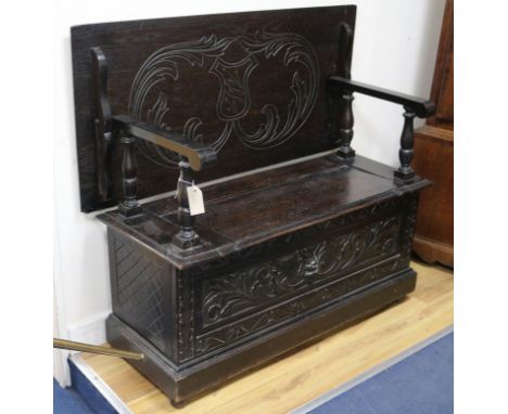 An oak monks bench W.106cm