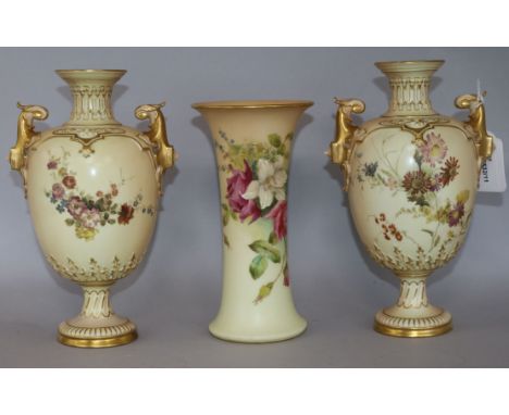 A pair of Royal Worcester blush ivory twin-handled pedestal ovoid vases and a similar tapered cylindrical vase, all painted w