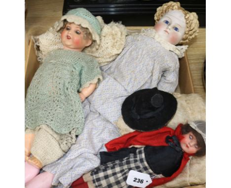 A German bisque-headed doll, no. 966 and two other dolls, including a large bisque head doll with moulded ceramic hair and co