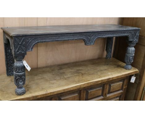 A Victorian carved oak bench W.117cm