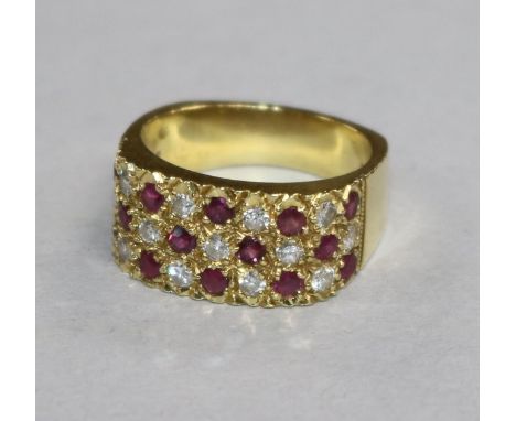 An 18ct gold, ruby and diamond pave set ring, size N.