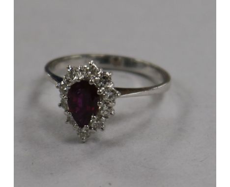 An 18ct gold ruby and diamond pear shaped cluster ring, size Q.