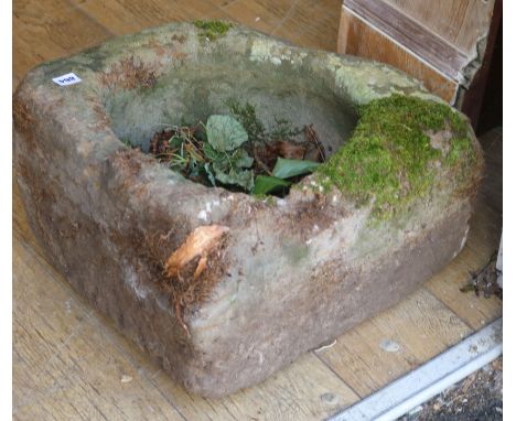A circular stone trough
